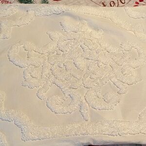 Elegant White Textured Quilt with matching pillow slips.